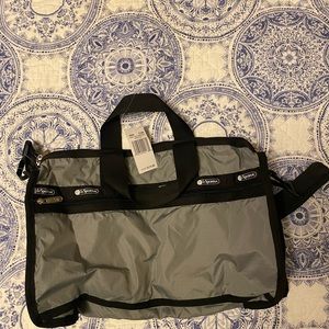 Candance classic duffle effortlessly holds your belongings w/ pockets & straps